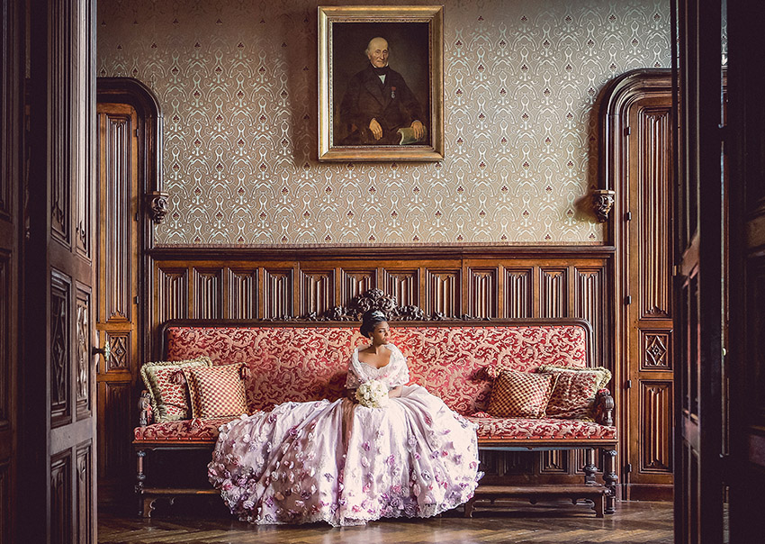 A bride sitting in Chateau de Challain