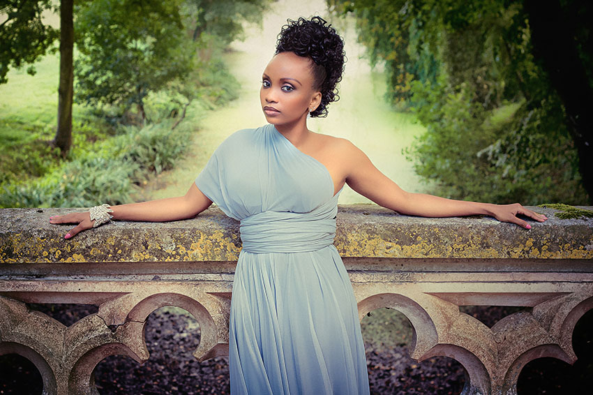 Portrait of a bridesmaid in Chateau de Challain's gardens